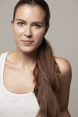 Image showing Beauty, portrait of young woman and in studio background. Self care or facial treatment, glamorous cosmetics or dermatology and female model posing for healthcare or skin wellness in backdrop