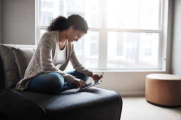 Image showing Tablet, credit card and girl on sofa and online shopping in home or ecommerce, paying for retail product and internet store. Latino woman, banking and money for service, digital payment or goods