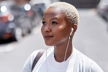 Image showing Music, vision and travel with a black woman in the city, thinking about future opportunity during the day. Mindset, idea and tourism with a young female traveler streaming audio in an urban town