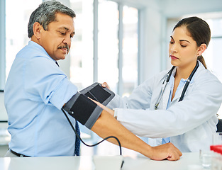 Image showing Doctor, man and patient with test, blood pressure and consultation with healthcare, office and checkup. Female person, senior male and medical professional with equipment, hypertension and wellness