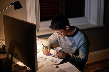 Image showing Young, man and student studying at night on a desk computer in a bedroom. College, guy and learning at apartment with coffee to study with technology and the internet for education at university.