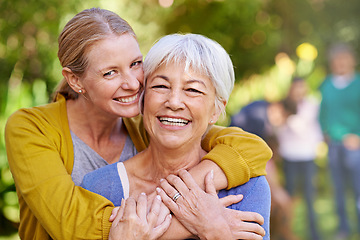 Image showing Mom, old woman and laughing with hug outdoor for happiness, love and care in portrait on holiday. Elderly mama, lady and embrace with bond, excited face and family in backyard with summer sunshine