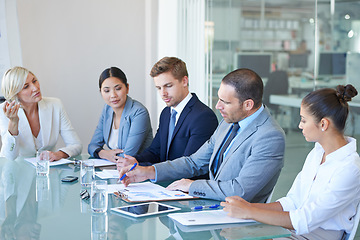 Image showing Boardroom, business people and meeting with executive team or management for b2b negotiation or planning. Men and woman at office table with finance paperwork talking about an opinion or solution