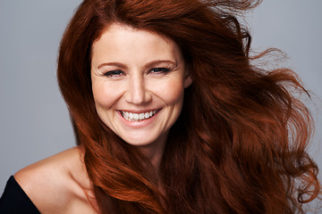 Image showing Hair care, ginger and portrait of happy woman with beauty for treatment, wellness and haircare on gray background. Salon, hairdresser and face of female model with red, healthy and natural hairstyle