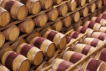 Image showing Storage, winery cellar and wood barrel collection or red wine, alcohol and luxury, vineyard industry container and process. No people, warehouse and expensive vintage, drink vault or grape business