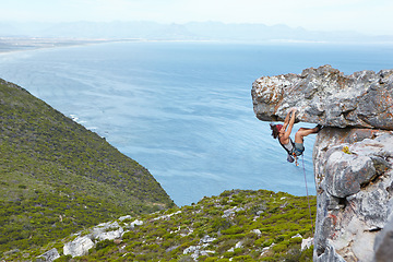 Image showing rock climbing, mountain and a woman hanging on a cliff with rope for adventure, travel and risk in nature. Female person outdoor for sports challenge, adrenaline and exercise for fitness in mountains