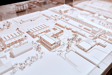 Image showing Office, plan and model with architecture for remodeling project of design with buildings and construction. Blueprint, workplace and real estate idea for company with strategy to start up company.