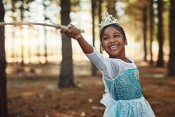 Image showing Forest, princess costume and girl with stick for playing fantasy, childhood games and happiness. Nature, fairy tale and face of happy child in woods play with branch for adventure, freedom and fun