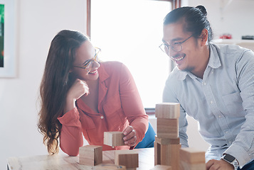 Image showing Team building, businessman and woman with wood blocks in office for vision challenge game and design innovation ideas. Engineering, architecture and creative startup with problem solving block games