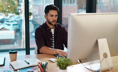 Image showing Business, computer and man working at a desk while online for research or creative work. Male entrepreneur person at workplace with focus and internet connection for designer project or reading email