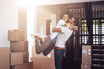 Image showing Moving in, couple hug and love with real estate sale and cardboard boxes at new apartment. Happiness, excited and African woman and man bonding together with a smile from mortgage and property deal