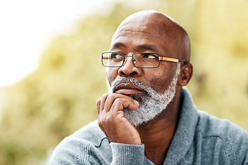 Image showing senior, black man and face thinking outdoor in nature to remember memory, idea or vision. Headshot of an elderly male person think or planning future, life insurance or retirement at a park in summer