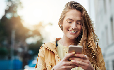 Image showing Happy woman check social media on smartphone, communication in city and chat online with connectivity. Young person and student smile at meme in urban street, contact with mobile app and tech outdoor