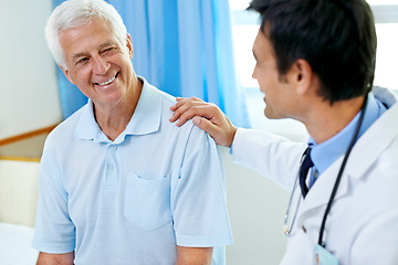 Image showing Doctor, senior man patient and discussion with smile, medical clearance and news for healthy in clinic. Men, happy medic and consultation for wellness, healthcare and talking in hospital for helping