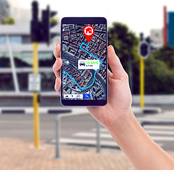 Image showing Closeup, city and hand with a smartphone, map and connection for direction, travel or streets. Holding a cellphone, person or traveler with a mobile app, roads or technology for transport or location