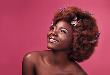 Image showing Thinking, smile and black woman with butterflies in her hair, fantasy and natural against a studio background. Female person, girl and model with joy, ideas and happiness with confidence and beauty