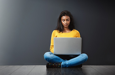 Image showing Woman, laptop and technology, student typing report with education, mockup space and connectivity. Focus, concentration and female person studying, research online for project and internet connection