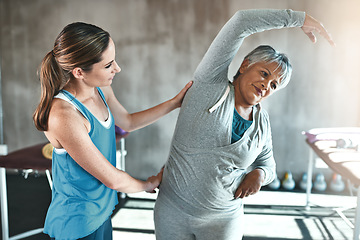 Image showing Stretching, help and old woman with personal trainer for fitness, wellness or rehabilitation. Health, workout or retirement with senior patient and female trainer in gym for warm up training