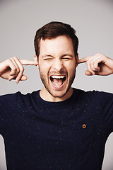 Image showing Man, scream and block ears in studio with anger, frustrated face and mental health problem by white background. Isolated guy, model and angry shout with stress, anxiety or noise by gray backdrop