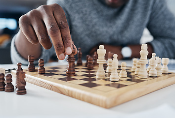 Image showing Closeup, hands and man playing chess, strategy and thinking with pieces, concentration and challenge. Zoom, male person and player with a game, hobby and activity for fun, recreation and chessboard