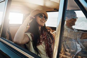 Image showing Happy couple, together and on a road trip in a car for freedom, travel and holiday. Smile, relax and a young man and woman in transportation driving for a vacation, date or an adventure in summer