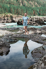 Image showing Woman resting at river