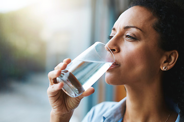 Image showing Drinking water, glass and woman thinking of healthcare, wellness and self care at home. Fresh, clean liquid and african person in window of her house with vision for health, diet and nutrition