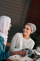 Image showing Friends, coffee and relax with Muslim women in cafe for conversation, food and social. Happy, smile and culture with arabic female customer in restaurant for discussion, happiness and meeting