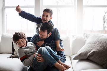 Image showing Dad with boy children, playing and energy with fun, carefree with love and laughter at family home. Man play with kids laughing in living room, crazy and playful with piggyback, hug and excited