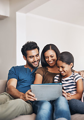 Image showing Family on a couch, happiness and tablet with connection, social media and watching a cartoon. Parents, mother and father with female child, daughter or technology for a movie, film or bonding at home