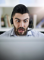 Image showing Stressed, frustrated or shocked man in call center reading fake news crisis or mistake with panic in office. Worried virtual assistant, anxiety or surprised consultant frustrated with computer error