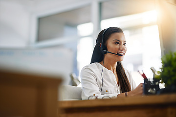 Image showing Customer service, virtual assistant or happy woman in call center consulting, speaking or talking at help desk. Contact us, friendly agent or sales consultant in telemarketing or telecom company