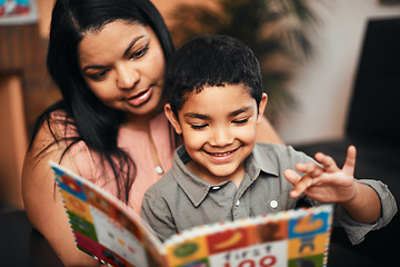 Image showing Mother, son and happy with book, learning and reading together with support, care and love in family home. Woman, boy child and teaching for education, development and life skills in house with story