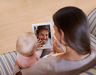 Image showing Family, video call and mother with baby on digital tablet with father while bonding on a sofa in their home. Online, conversation and woman with kid on a couch, relax and content while speaking