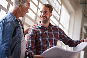 Image showing Building, employees and men with a blueprint, planning and discussion for a new project, smile and architects. Male builders, happy contractors and handyman with a client, architecture and documents