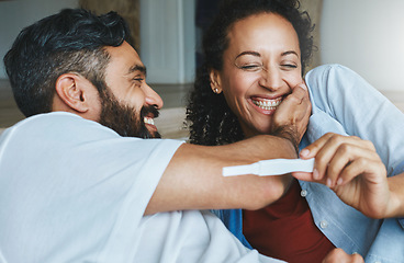 Image showing Happy couple, excited and smile for pregnancy test together for happiness, laughing and excitement. Love, funny and a man and pregnant woman looking excited and reading results for a baby at home