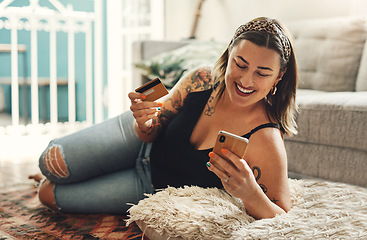 Image showing Phone, credit card and woman on floor for online shopping, e commerce and fintech payment, loan or finance at home. Happy person relax on carpet, typing and internet banking on mobile app transaction