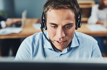 Image showing Businessman, call center and consulting with headphones on computer in customer service, support or telemarketing at office. Man consultant agent talking on PC for online advice or help in contact us