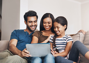 Image showing Relax, smile and family on a sofa, tablet and bonding at home, connection and streaming a movie. Parents, mother and father on a couch, games and female child in the living room with cartoon film