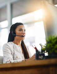 Image showing Virtual assistant, customer services or woman in call center consulting, speaking or talking at help desk. Communication, contact us or sales consultant in telemarketing or telecom company office