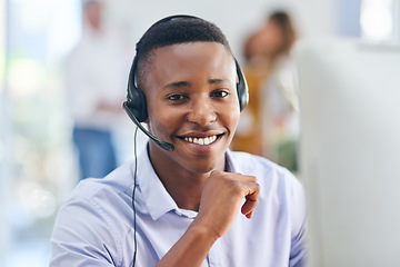 Image showing Virtual assistant, portrait or happy black man in call center consulting or talking at customer services. Communication, friendly smile or face of sales agent on mic in telemarketing or telecom desk