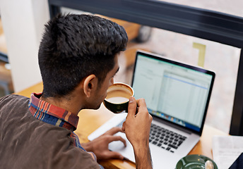 Image showing Man drinking coffee while working with a laptop in a cafeteria doing research for remote work project. Technology, caffeine and male employee planning a creative report on a computer in restaurant.