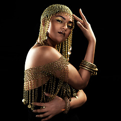 Image showing African woman, portrait and gold fashion with beauty and cosmetics in a studio. Isolated, black background and young female face with crown, Egypt jewelry and culture empowerment with queen pride