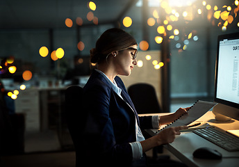 Image showing Night, notes or business woman reading research or paperwork overtime working on digital strategy. Late, lens flare or focused employee with portfolio file for project deadline on internet in office