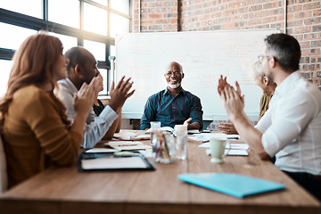 Image showing Business people, meeting and applause of black man in office for congratulations, goals or target. Happy, group clapping and senior African male professional with employees in celebration of success.