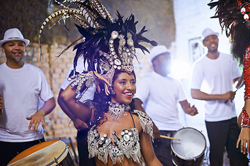 Image showing Celebration, dance and exotic female dancer performing with a band at mardi gras or cultural festival. Performance, costume and woman dancing with rhythm to live music at a carnival in Rio de janeiro