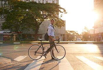 Image showing Morning, bike and business man in city for commute, travel and carbon footprint. Cycling, transportation and urban with male employee walking on crosswalk for journey, transit and professional