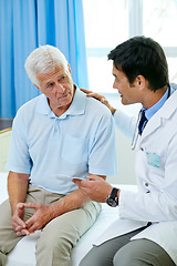 Image showing Consultation, doctor and old man in hospital room with advice, help and support from senior care clinic. Retirement, discussion on results and elderly patient sitting on bed with medical professional