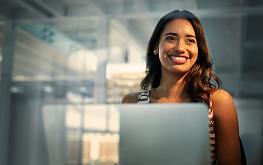 Image showing Laptop, thinking and glass with a business woman in the office, working while sitting at her desk. Computer, idea or smile and a happy young female employee with a vision of the future at work