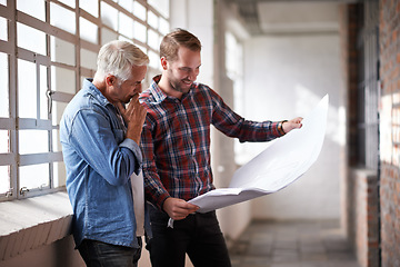 Image showing Architecture teamwork, holding blueprint and reading with planning, analysis or thinking of real estate. Men, paper and design for property, construction or building with talk, brainstorming and help